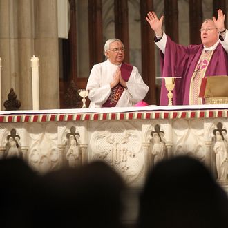 NEW YORK, NY - MARCH 09: Archbishop Timothy M. Dolan (R) leads Ash Wednesday mass at Saint Patrick's Cathedral on March 9, 2011 in New York City. Ash Wednesday marks the beginning of Lent and involves the placing ashes on the foreheads of Christian believers as a sign of repentance which occurs 40 days, excluding Sundays, before Easter. (Photo by Mario Tama/Getty Images) *** Local Caption *** Timothy M. Dolan