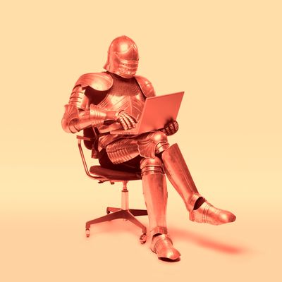 knight in armor using laptop