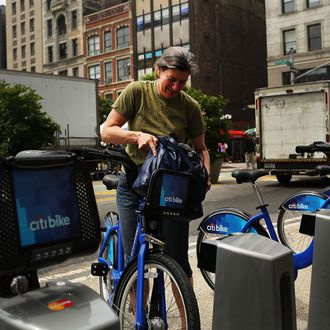Julie Iovine returns a Citi Bike to a docking station in Union square on May 29, 2013 in New York City. Citi Bike, the long awaited bike sharing program that launched over the Memorial Day weekend in New York, provides 6,000 bikes which are available for short-term rental at 330 stations in Manhattan below 59th Street and parts of Brooklyn. Until June 2nd only members of the Citi Bike program can use the bikes. The bikes will rent daily for $9.95 (plus tax ) or weekly for $25 and will be limited to trips of 30 minutes each. More than 16,000 people have signed up to be members so far.
