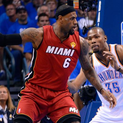 LeBron James #6 of the Miami Heat posts up Kevin Durant #35 of the Oklahoma City Thunder in the first quarter in Game One of the 2012 NBA