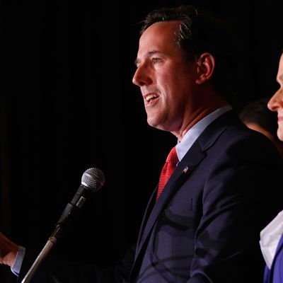 ST. CHARLES, MO - FEBRUARY 7: Republican presidential candidate, former U.S. Sen. Rick Santorum speaks to supporters as his wife, Karen, looks on, February 7, 2012 at the St. Charles Convention Center in St. Charles, Missouri. According to early results, Santorum defeated former Massachusetts Gov. Mitt Romney, former Speaker of the House Newt Gingrich and U.S. Rep. Ron Paul (R-TX) in Missouri, Minnesota nd is leading in Colorado. (Photo by Whitney Curtis /Getty Images)