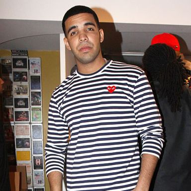 The sweater and/or label enthusiast will recognize the googly-eyed red heart on Drake's chest as the logo for Japanese fashion house Comme des Garçons PLAY. Drake, as we will see, is a devoted CDG fan — a collector, you might say, since a fine sweater is in its own way a piece of art. Here, he sports a timeless nautical-stripe crewneck that brings a hint of French New Wave to an otherwise dreary red carpet. Its pattern and material blur the lines between masculine and feminine, shirt and sweater.