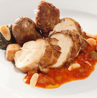 Label Rouge Chicken: oven-roasted breast and housemade sausage of thigh, liver, raisins and fresh herbs, panisses, tomato, and peppers.