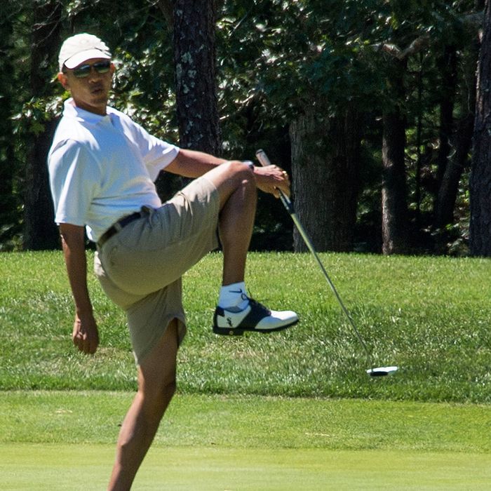 US President Barack Obama reacts to a missed putt on the first green at Farm Neck Golf Club in Oak Bluffs, Massachusetts, August 11, 2013, during his family faction to Martha's Vineyard. 