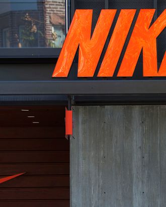 Nike Inc. signage is displayed outside of a store at the Third Street Promenade outdoor mall in Santa Monica, California, U.S, on Monday, Dec. 5, 2011. Since the Federal Reserve's last meeting early in November, reports on employment, manufacturing and retail sales have dispelled concerns the world's largest economy may slide back into recession.