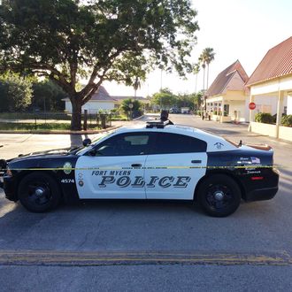 A police vehicle blocks off the area near Club Blu after a fatal shooting in Fort Myers, Fla., Monday, July 25, 2016. (AP Photo/Joshua Replogle)