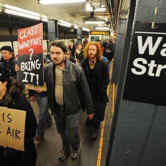 Demonstrators with 'Occupy Wall Street' march through a subway station at Wall Street on their way towards the New York Stcok Exchange as they mark the two month anniversary of the protest November 17, 2011 in New York. AFP PHOTO/Stan HONDA (Photo credit should read STAN HONDA/AFP/Getty Images)