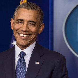 US President Barack Obama smiles after making a statement in the briefing room of the White House on August 1, 2014 in Washington. Obama declared that the US economy was getting stronger and had generated 