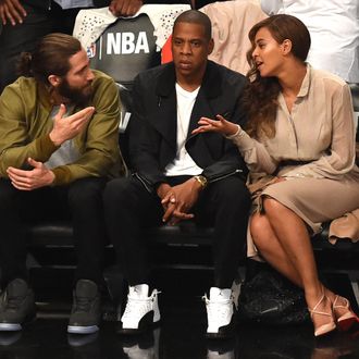 Jake Gyllenhaal (L), Jay Z (C) and Beyonce (R) watch the Miami Heat against the Brooklyn Nets during Game 3 of their NBA Eastern Conference Semifinal at the Barclays Center on May 10, 2014.
