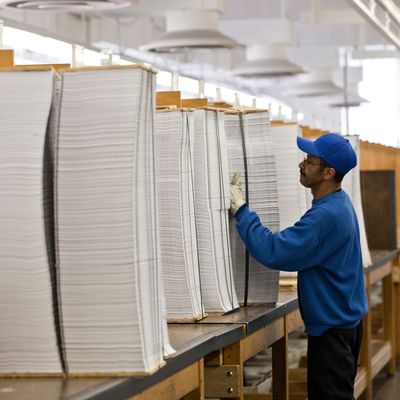 Printed copies of President Barack Obama's proposed budget plan for fiscal year 2014 are prepared for binding at the U.S. Government Printing Office in Washington, Monday, April 8, 2013. (AP Photo/J. Scott Applewhite)