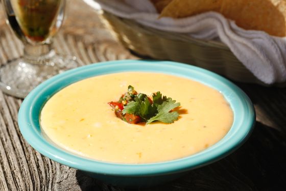 Chile con Queso: Homemade blend of melted cheese, green chiles and pico de gallo.