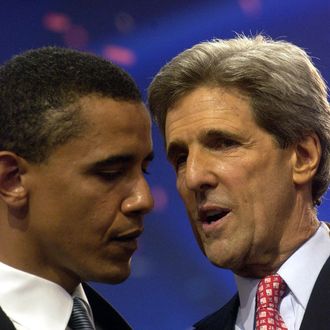 Democratic presidential nominee John Kerry talks with U.S. Senate candidate Barack Obama from Illinois onstage July 29, 2004 during the Democratic National Convention at the FleetCenter in Boston, Massachusetts. Kerry accepted his party's presidential nomination during his speech this evening bringing the convention to a close. 