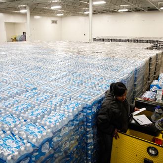 Pallets of bottled water are seen ready for distribution in a warehouse January 21, 2016 in Flint, Michigan. The warehouse is the emergency water supply for Flint residents affected by lead-contaminated water. 