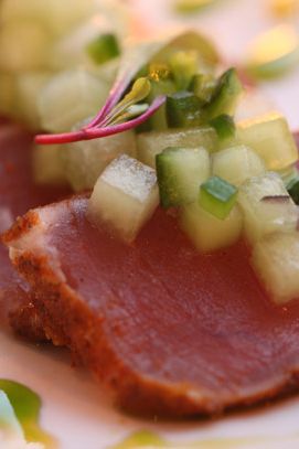 Spice-crusted ahi tuna with honeydew, avocado, and chili oil.