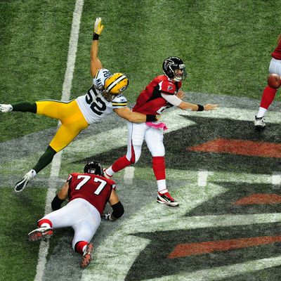 ATLANTA, GA - OCTOBER 9: Matt Ryan #2 of the Atlanta Falcons passes despite pressure by Clay Matthews #52 the Green Bay Packers at the Georgia Dome on October 9, 2011 in Atlanta, Georgia. (Photo by Scott Cunningham/Getty Images)