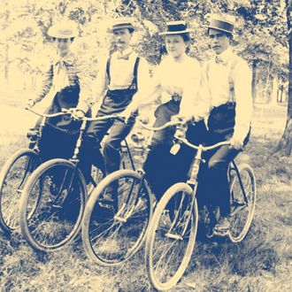 A quartet poses on their bikes, ca. 1895.