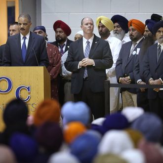 U.S Attorney General Eric Holder speaks at Oak Creek High School during a memorial service for the slain 6 members of the Sikh Temple of Wisconsin on August 10, 2012 in Oak Creek, Wisconsin. Bhai Seeta Singh, Bhai Parkash Singh, Bhai Ranjit Singh, Satwant Singh Kaleka, Subegh Singh, and Parmjit Kaur Toor were killed when Wade Michael Page, a suspected white supremacist, went on a shooting rampage at the temple August 5. Page also died at the temple after being shot by police then shooting himself. 