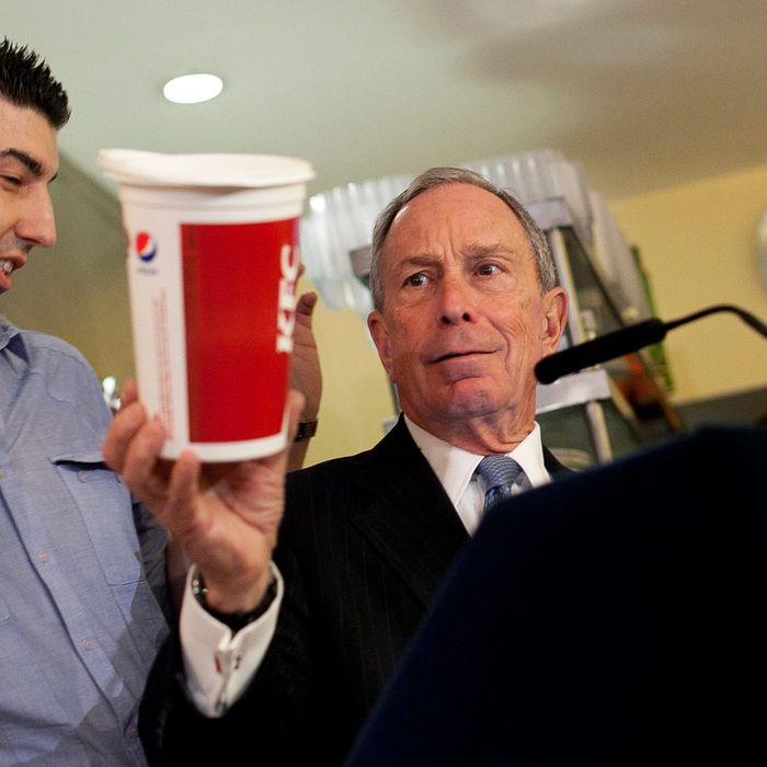 New York City Mayor Michael Bloomberg holds a large cup as he speaks to the media about the health impacts of sugar at Lucky's restaurant, which voluntarily adopted the large sugary drink ban, March 12, 2013 in New York City. A state judge on Monday blocked Bloomberg's ban on oversized sugary drinks but the Mayor plans to appeal the decision. 