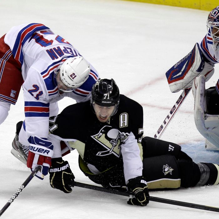 Pittsburgh Penguins' Evgeni Malkin (71) collides with New York Rangers' Derek Stepan (21) in front of goalie Henrik Lundqvist during the first period of an NHL hockey game in Pittsburgh, Tuesday, Feb. 21, 2012.