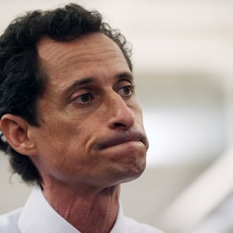 NEW YORK, NY - JULY 23: Anthony Weiner, a leading candidate for New York City mayor, stands with his wife Huma Abedin during a press conference on July 23, 2013 in New York City. Weiner addressed news of new allegations that he engaged in lewd online conversations with a woman after he resigned from Congress for similar previous incidents. (Photo by John Moore/Getty Images)