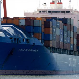 A ship named Ville D' Aquarius is docked at the Port Newark container terminal, Wednesday, June 27, 2012, in Newark, N.J. The Coast Guard suspects there are stowaways in a container that was loaded on a ship. Coast Guard spokesman Charles Rowe says the container was loaded aboard The Villa D'Aquarius in India. The manifest says the container was carrying machine parts to be unloaded in Norfolk, Va. (AP Photo/Julio Cortez)