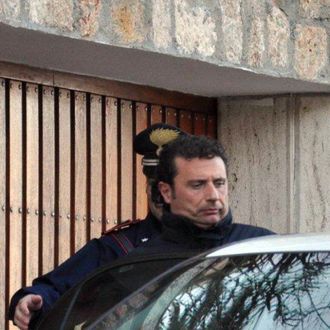The captain of the Costa Concordia cruise liner Francesco Schettino is escorted by an Italian policeman in Grosseto on January 14, 2012. 