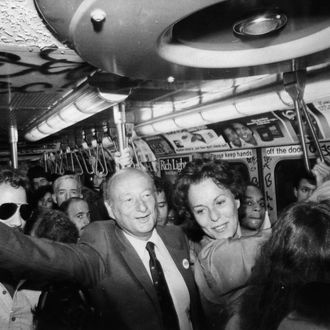 Mayor Ed Koch and Senatorial candidate Bess Myerson campaigning on the subway. September 1980.