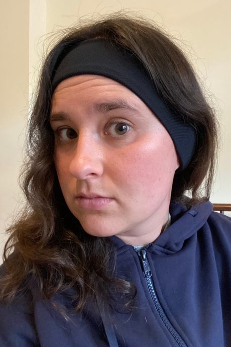 A person wearing a black headband.