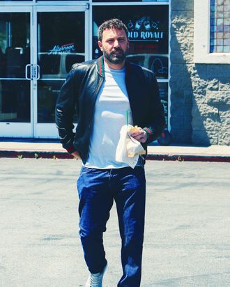 Ben Affleck scratching his tat.