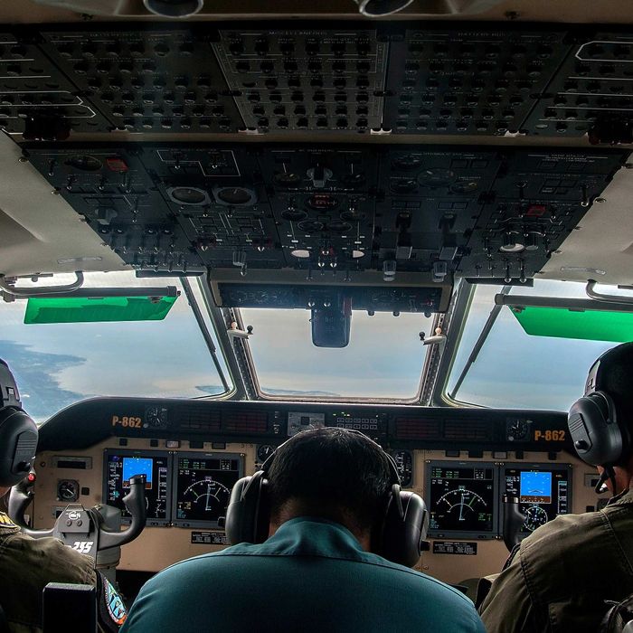 Indonesian Army personnel keep watch during a search and rescue (SAR) operation for missing Malaysian air carrier AirAsia flight QZ8501, over the waters of the Java Sea on December 29, 2014. 