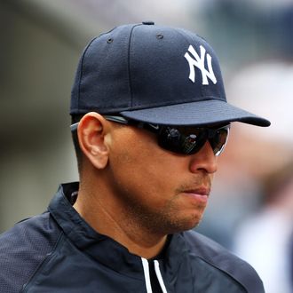 Alex Rodriguez #13 of the New York Yankees looks on from the dugout during the game against the Boston Red Sox on Opening Day on April 1, 2013 at Yankee Stadium in the Bronx borough of New York City.