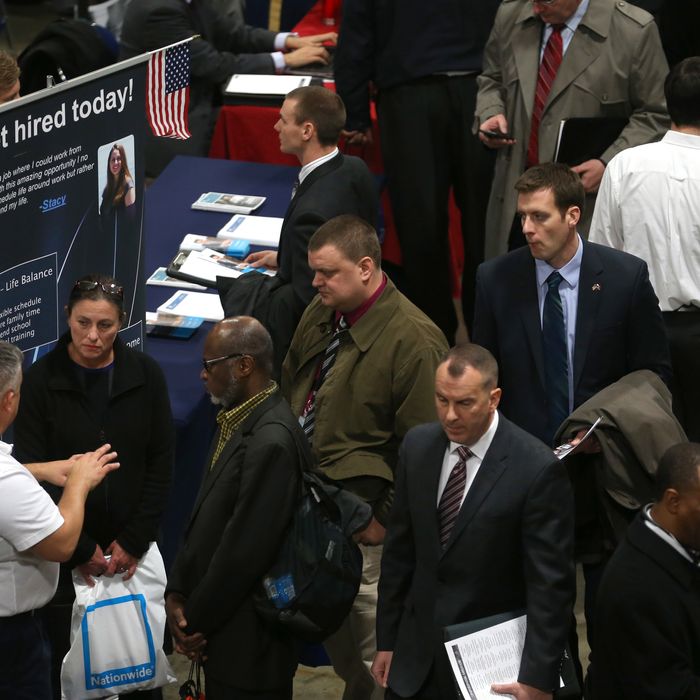 People visit booths of prospective employers during the Hiring Our Heroes job fair at the Washington Convention Center, on January 10, 2014 in Washington, DC. 