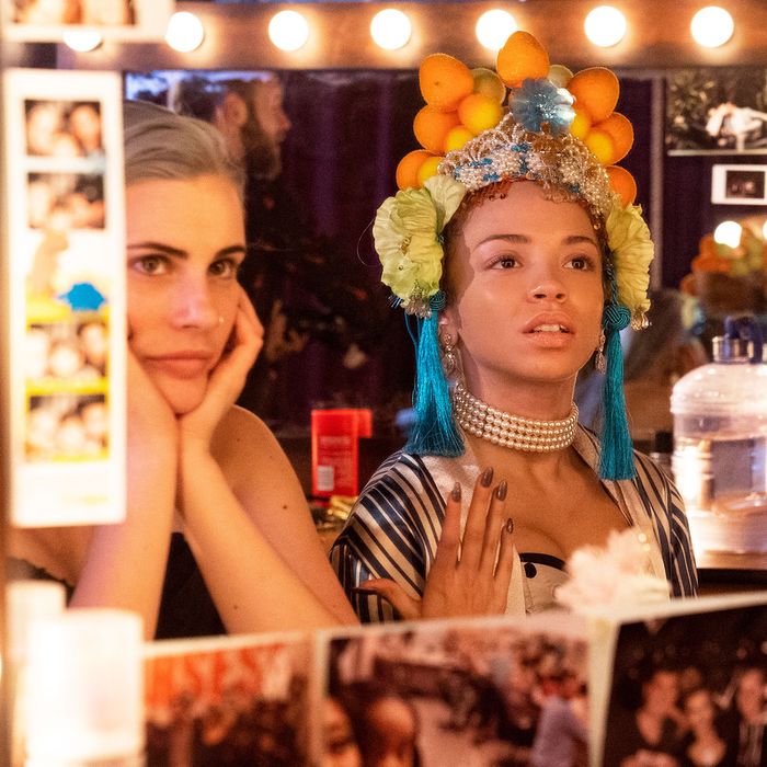 Caitlyn Ary and Erica Gluck look into a mirror