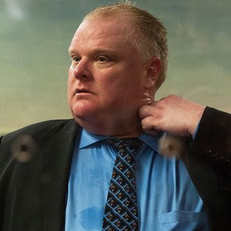 TORONTO, CANADA- NOVEMBER 15: Toronto Mayor Rob Ford Toronto Mayor Rob Ford waks in City Hall after City Council stripped him of some management powers on November 15, 2013 in Toronto, Canada .The council voted to strip the embattled Ford striped him of striped him of authority during emergency situations and the ability to hire and fire the deputy mayor and appoint members of the executive committee. (Photo by Aaron Vincent Elkaim/Getty Images)