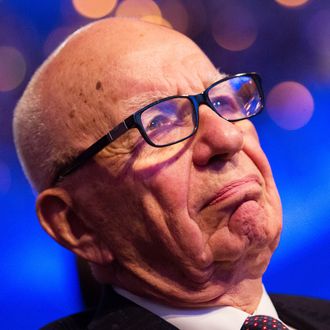 Rupert Murdoch listens to U.S. President Barack Obama make remarks at the Wall Street Journal CEO Council annual meeting, at the Four Seasons Hotel, on November 19, 2013, in Washington, DC. Obama discussed immigration reform and the health care rollout, among other topics.