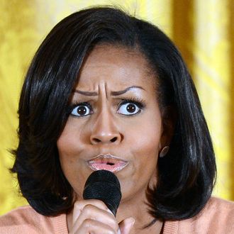 US First Lady Michelle Obama answers a question as he meets with children of Executive Office employees in the East Room on April 26, 2012 in Washington, DC, during the White House?s annual Take Our Daughters and Sons to Work Day. 