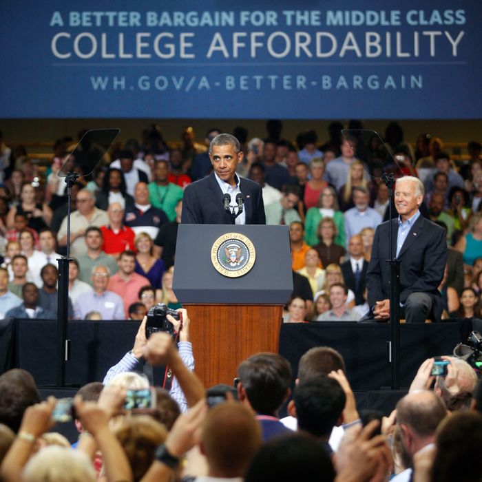 SCRANTON, PA - AUGUST 23: U.S. President Barack Obama, (L) speaks at an event as U.S. Vice President Joe Biden, (R), looks on at Lackawanna College on August 23, 2013 in Scranton, Pennsylvania. Obama is on his second day of a bus tour of New York and Pennsylvania to discuss his plan to make college more affordable, tackle rising costs, and improve value for students and their families. (Photo by Jessica Kourkounis/Getty Images)