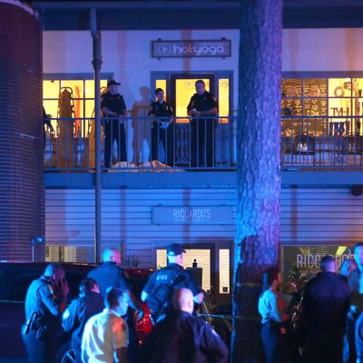 Police investigators work the scene of a shooting at Hot Yoga Tallahassee on Friday, November 2.