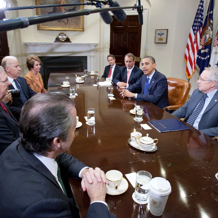 US President Barack Obama(2nd R) and Vice President Joe Biden (across) meet at the White House with Senate Majority Leader Harry Reid (D-NV), Senate Minority Leader Mitch McConnell (R-KY), Speaker John Boehner (R-OH) House Minority Leader Nancy Pelosi (D-CA)and other cabinet members on November 16, 2012 in Washington,DC. Obama said Friday that Democrats and Republicans needed to make 'tough compromises' in order to overcome divisions over deficit reduction and avoid the fiscal cliff.
