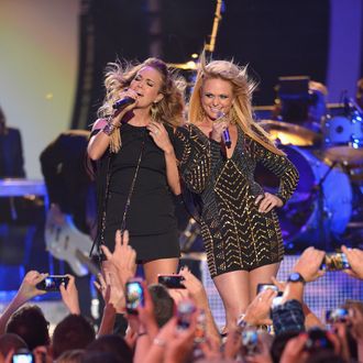 NASHVILLE, TN - JUNE 04: Carrie Underwood and Miranda Lambert perform onstage at the 2014 CMT Music Awards at Bridgestone Arena on June 4, 2014 in Nashville, Tennessee. (Photo by Michael Loccisano/Getty Images for CMT)