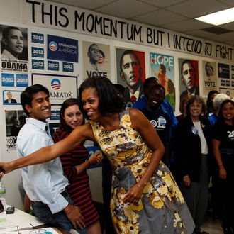 First lady Michelle Obama greets volunteers during a visit to a campaign field office during a visit in Raleigh, N.C., Wednesday, Aug. 1, 2012.