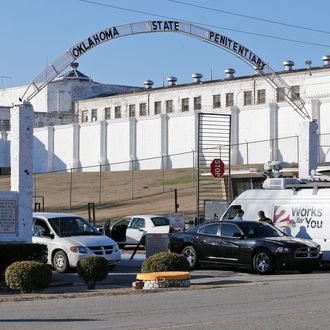 A news van arrives at the front gate of the Oklahoma State Penitentiary for the scheduled execution of Charles Warner in McAlester, Okla, Thursday, Jan. 15, 2015.