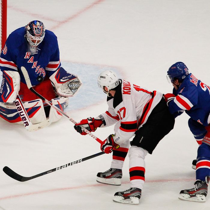 Henrik Lundqvist #30 of the New York Rangers makes a save against Ilya Kovalchuk #17 of the New Jersey Devils as Ryan McDonagh #27 of the New York Rangers defends in the first period of Game One of the Eastern Conference Finals during the 2012 NHL Stanley Cup Playoffs at Madison Square Garden on May 14, 2012 in New York City.