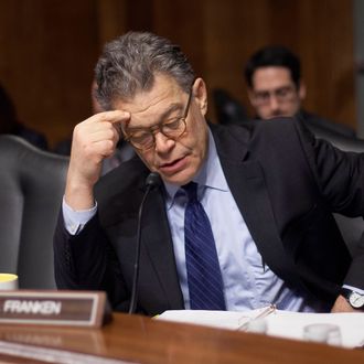 In this Feb. 4, 2014 file photo, Senate Judiciary Committee member Sen. Al Franken, D-Minn., reads over his notes before the start of a hearing on data breaches and combating cybercrime on Capitol Hill in Washington. “We now have this incredible acceleration of information technology and there are privacy issues that are both sort of Constitutional issues, but also commercial issues,” Franken said in an interview with The Associated Press on Friday, Oct. 3, 2014. (AP Photo/Pablo Martinez Monsivais, File)
