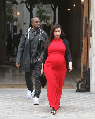 Pregnant Kim Kardashian and Kanye West strolling in Paris on April 30, 2013.