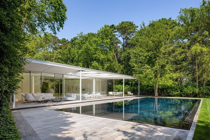 Foster, who bought the house in 2011, added a poolhouse in his trademark modernist style, as shown in listing photos.