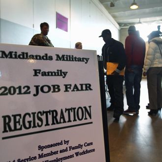 South Carolina National Guardsmen, veterans and their families line up to meet potential employers at a military job fair on January 19, 2012 in Columbia, South Carolina. 