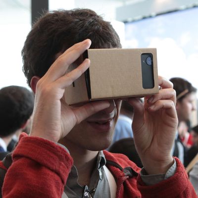 A participant examines the so-called 'Project Cardboard' which converts an android smartphone into a stereoscope with a cardboard construction during the developers conference Google I/O in San Francisco, USA, 25 June 2014.