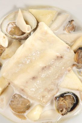 Braised sea bass, shellfish & Champagne sauce