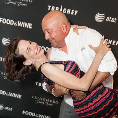 Andrew Zimmern dips Food & Wine Editor in Chief Dana Cowin on the Welcome Reception’s green carpet.